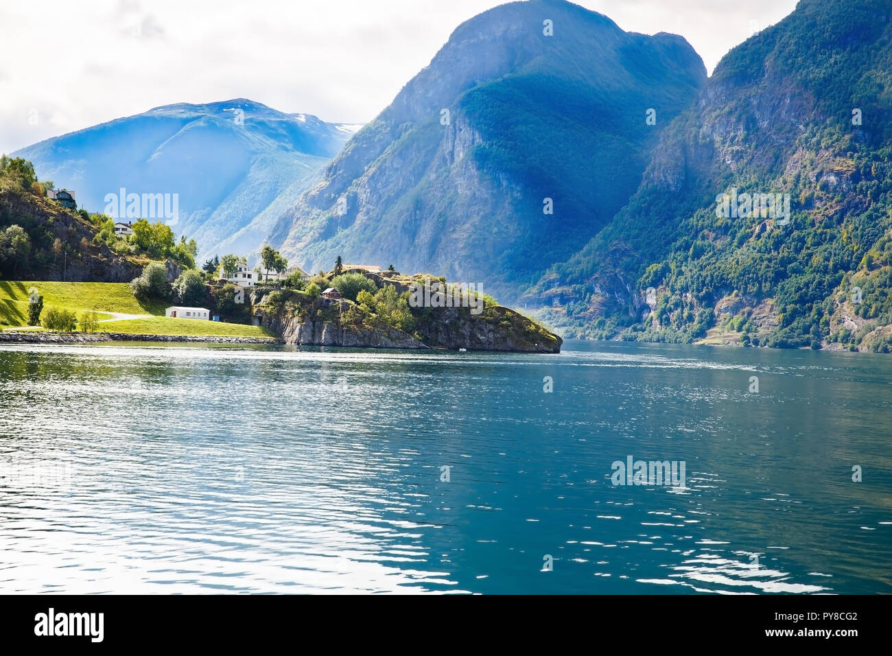 Landscape with Naeroyfjord, mountains and traditional village houses in ...