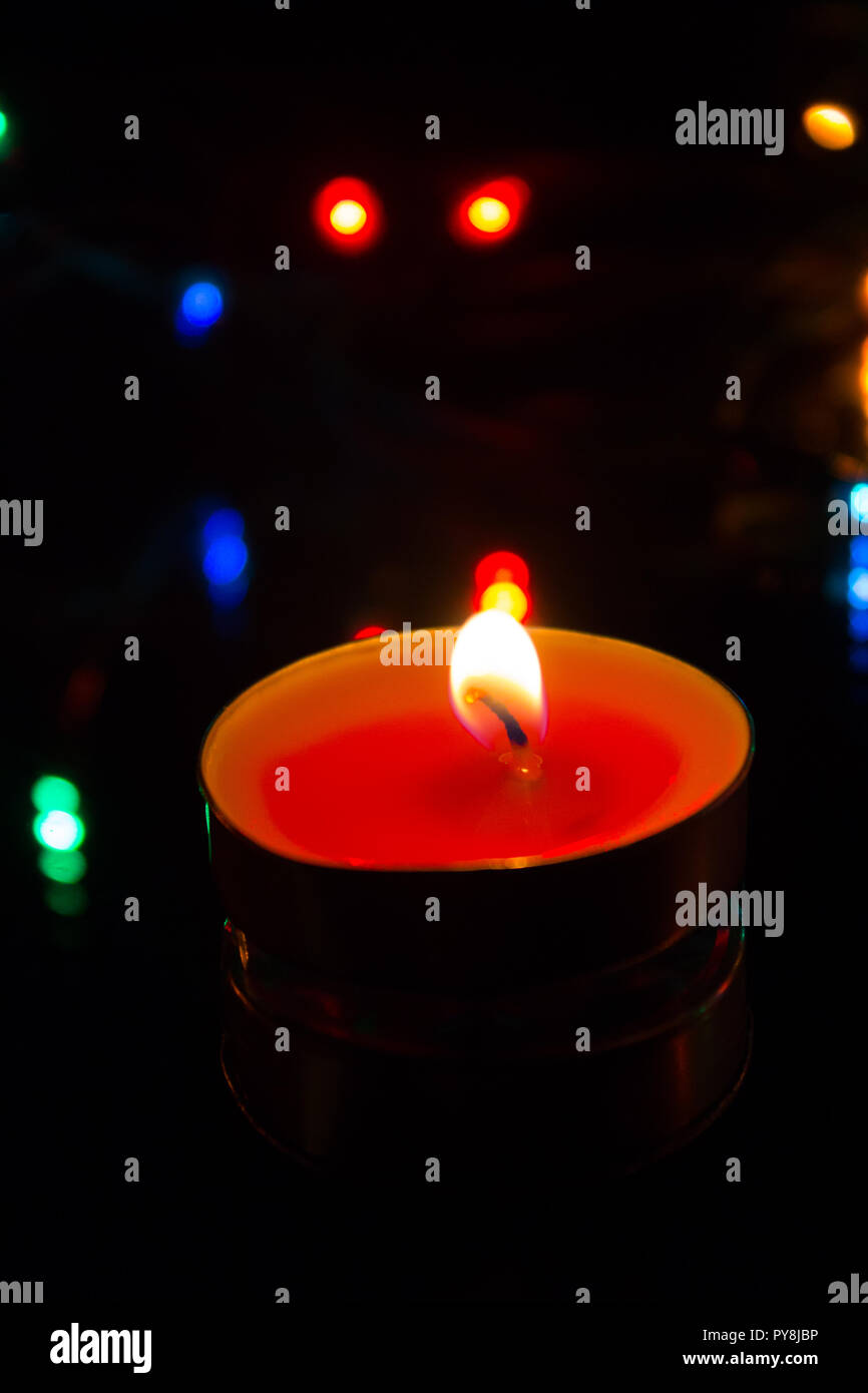 Wax candles burn in dark light. Wax candle. Burning fire Light from the