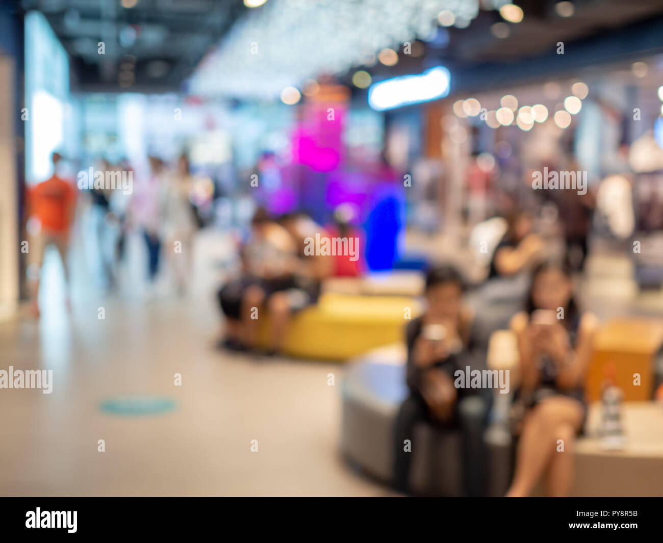 Blurred shopping mall background with people and bokeh Stock Photo - Alamy