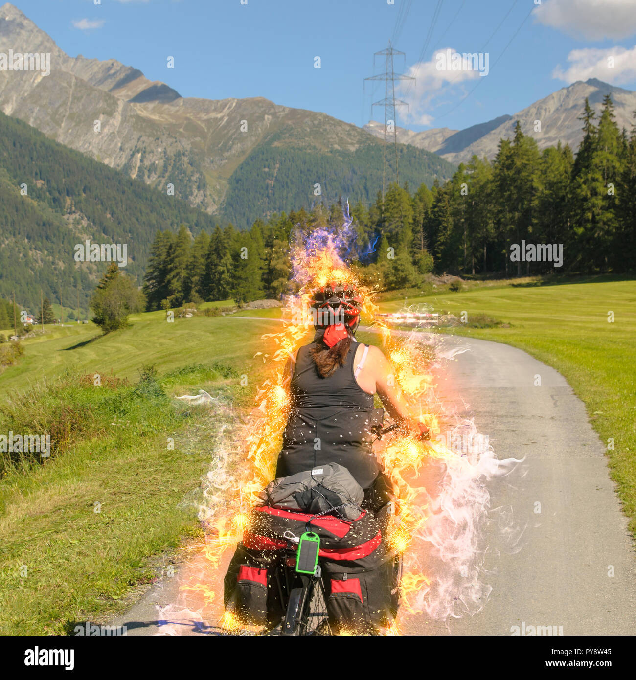 Digitally enhanced Female cyclist on the Inn Route near Susch (or Sus) Zernez, Graubünden, Switzerland Stock Photo