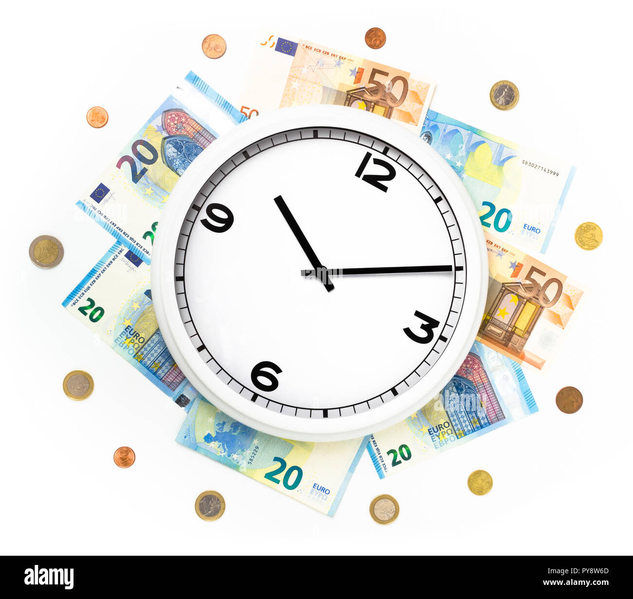 Clock surrounded by bills and euro coins. Concept of  time, money, work and life. Time is money. Stock Photo