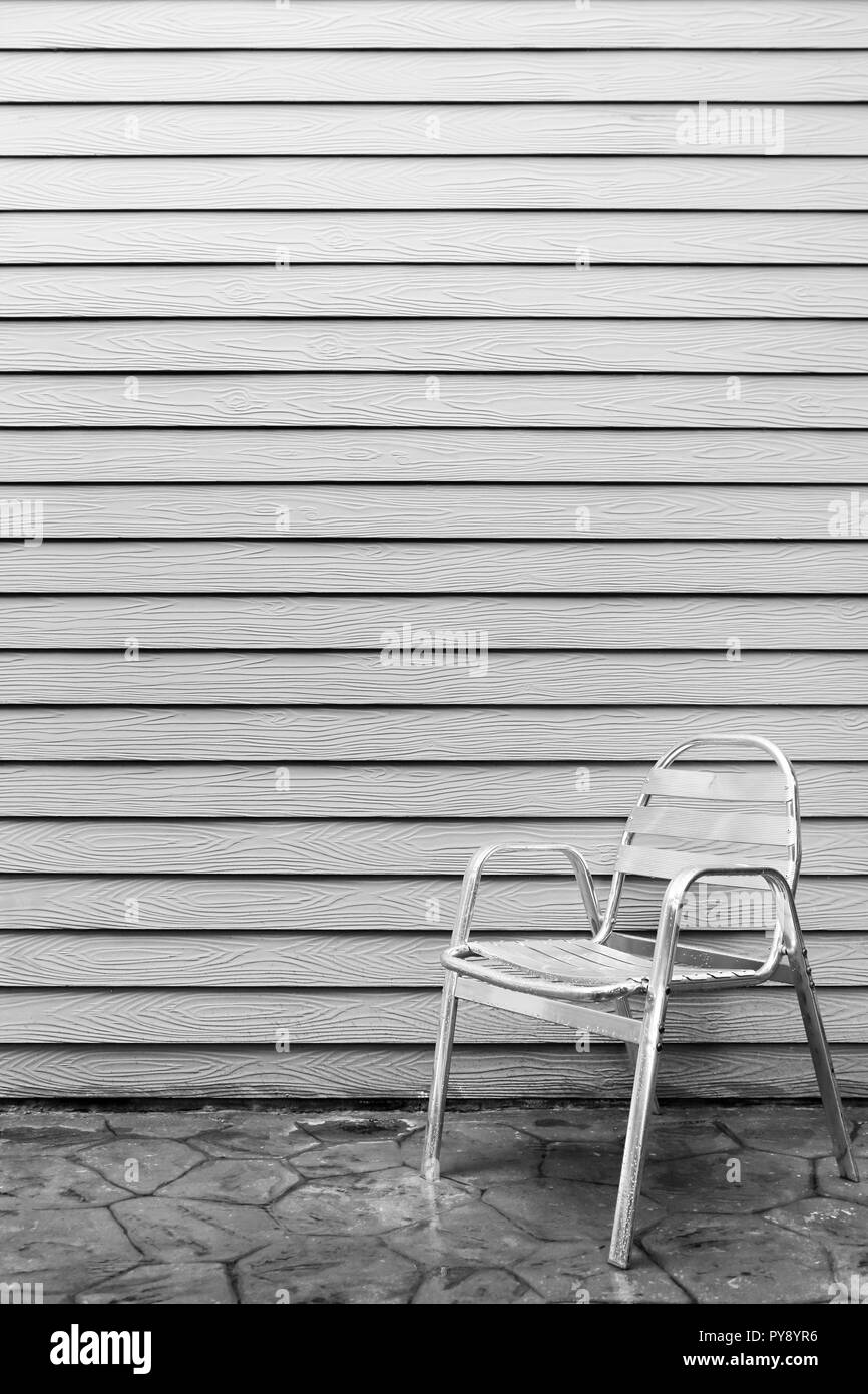 Wet lonely metal chair outside the house after raining Stock Photo Alamy