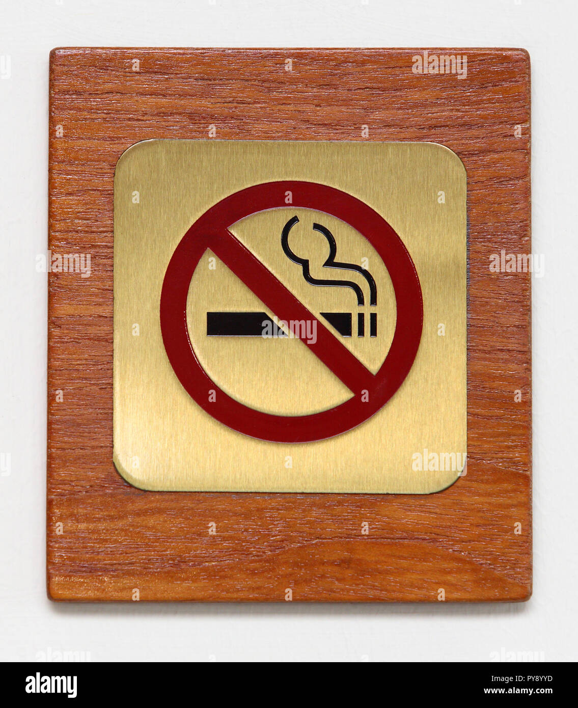 brass no smoking sign on plywood isolated on white Stock Photo Alamy