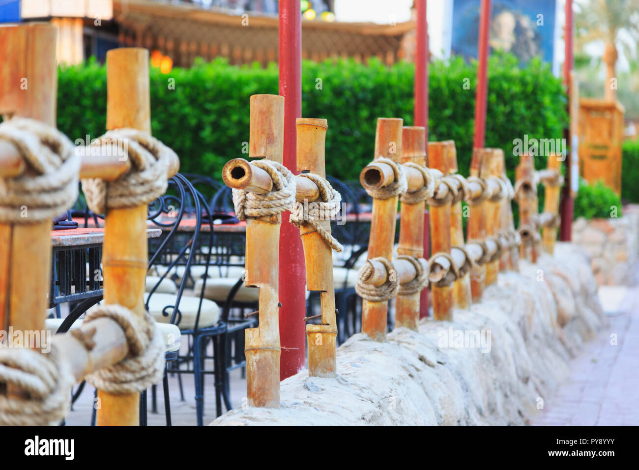 designer creative bamboo fence tied with rope in the cafe outside Stock ...