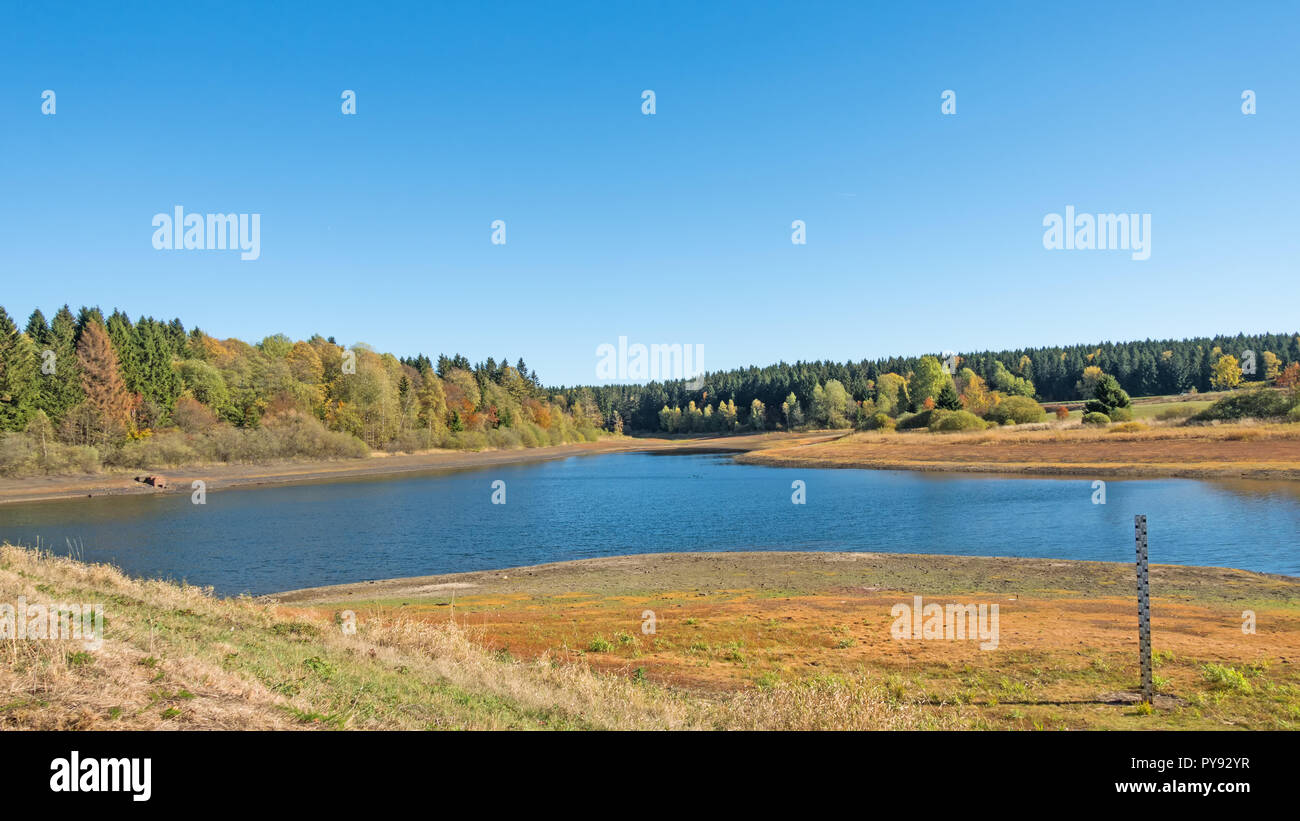 Lake 'Mittlerer Pfauenteich' in the Harz mountains, Germany, with low water level because of a dry summer Stock Photo