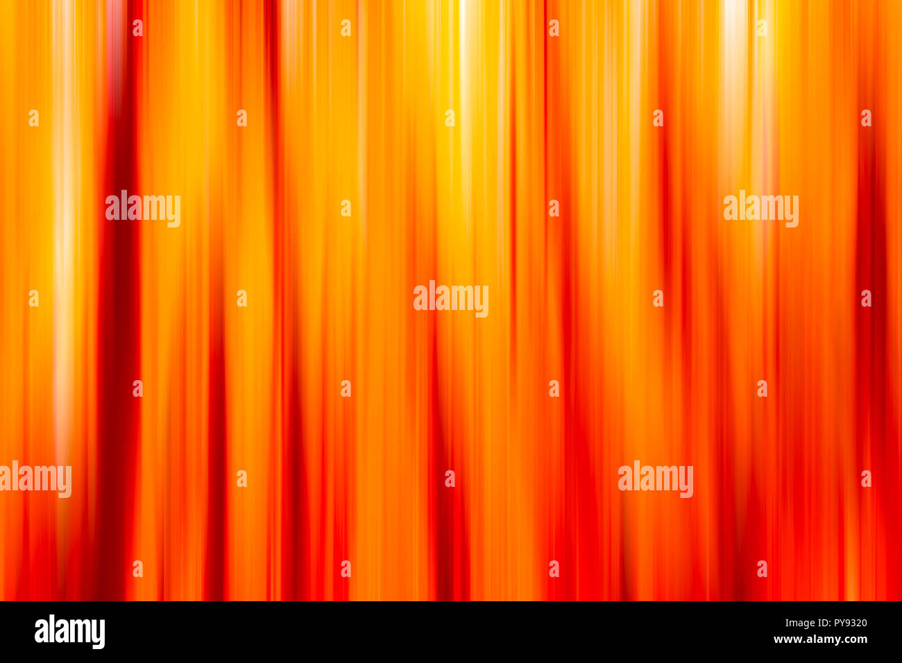 backdrop of  blurred defocused vertical colorful lines in yellow and orange and white Stock Photo