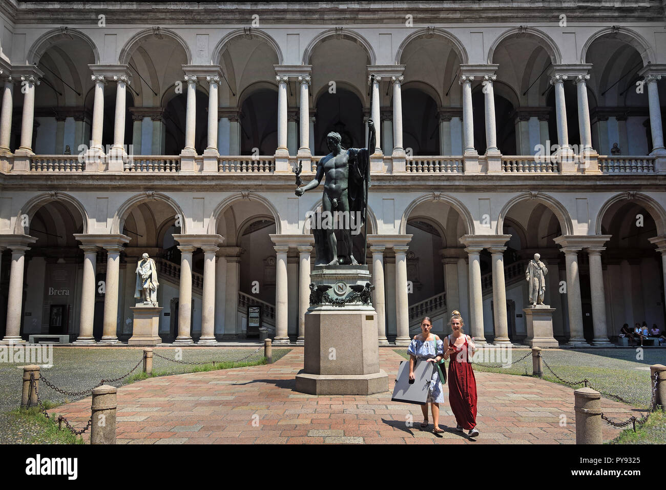 17th century courtyard Palace of Brera at Milan. Italy, Italian. The courtyard, with a bronze copy of Antonio Canova's statue of Napoleon as Mars the Peacemaker. (Palazzo Brera or Palazzo di Brera is a monumental palace in Milan, in Lombardy in northern Italy.) Stock Photo