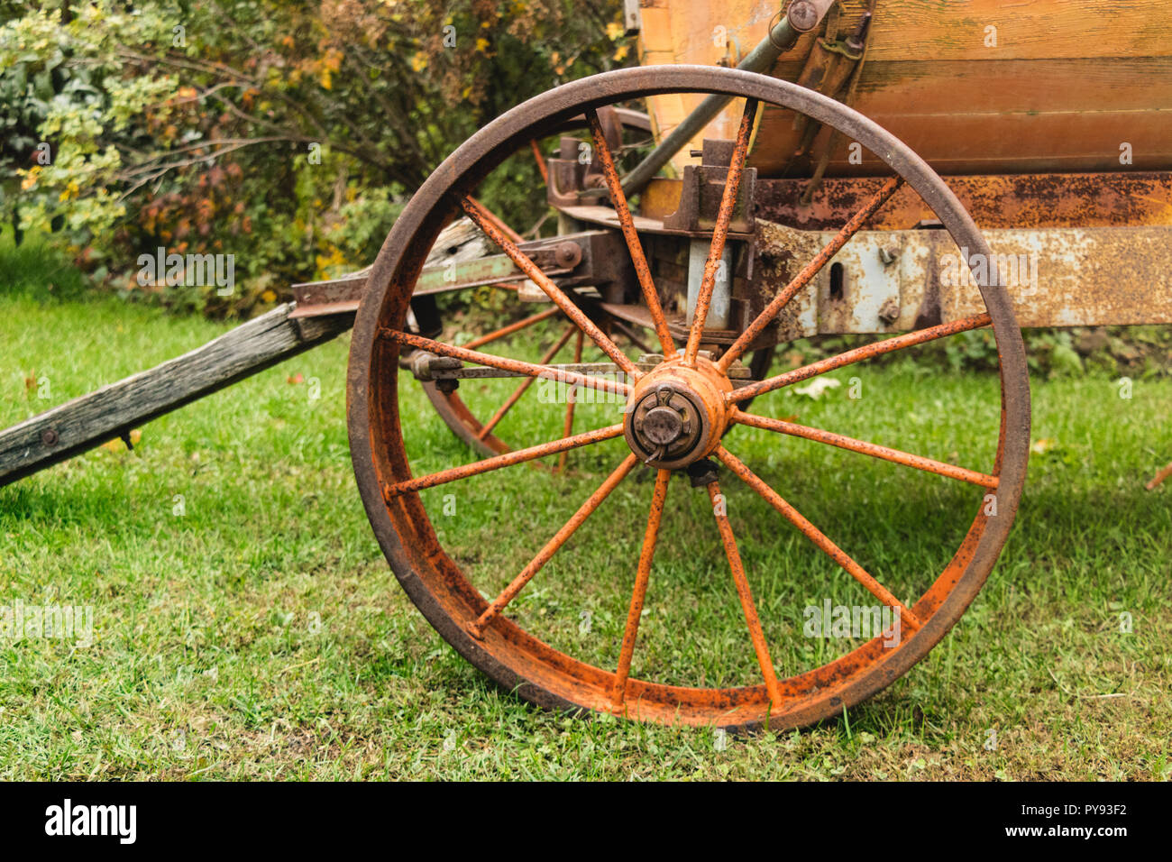 Antique farm equipment - rusted wheel, close-up Stock Photo
