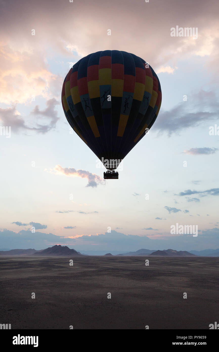 Namibia travel - hot air balloon at sunrise over the Namib desert - example of Adventure Travel, Namibia Africa Stock Photo