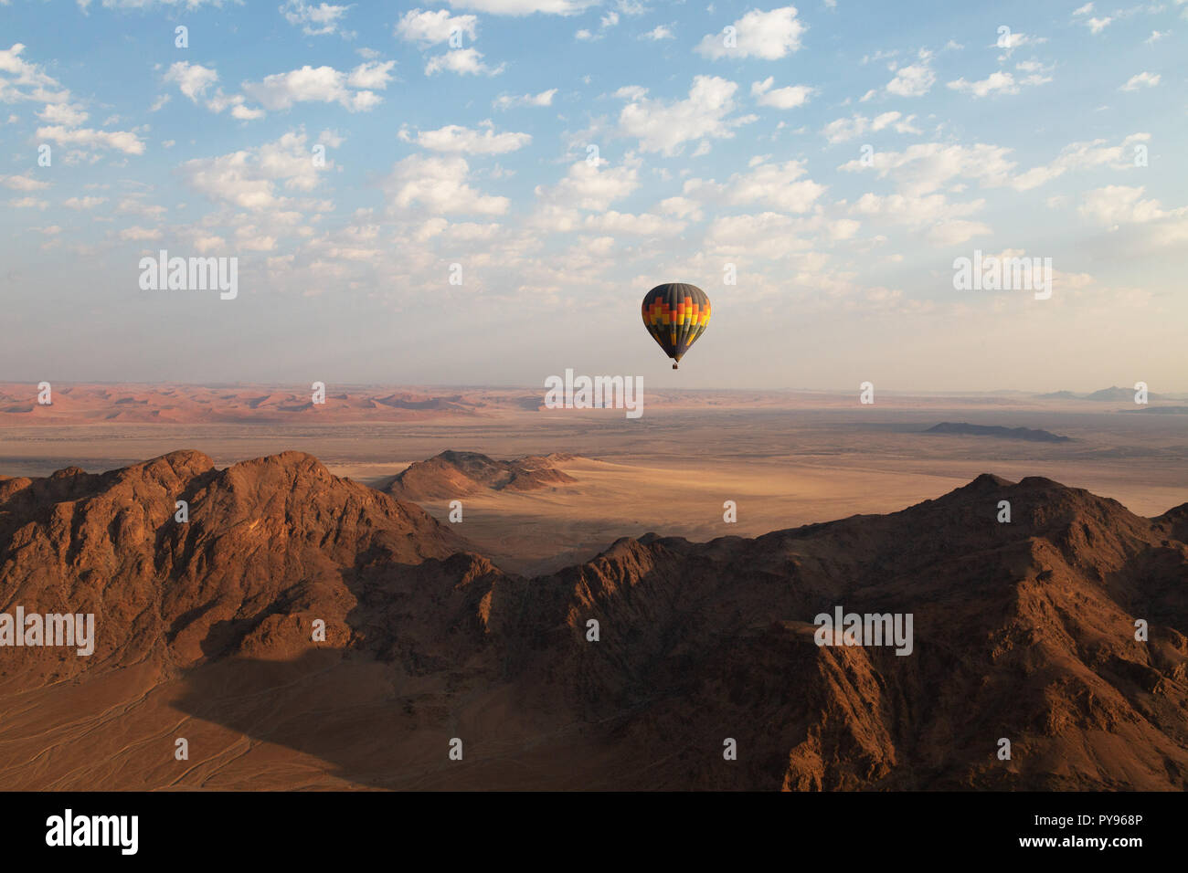 Namibia travel - hot air balloon at sunrise over the Namib desert - example of Adventure Travel, Namibia Africa Stock Photo