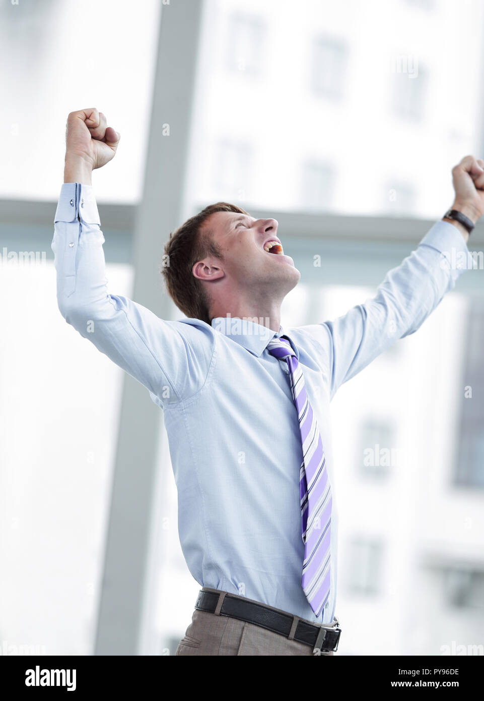 Businessman celebrating with his fists raised in the air Stock Photo ...