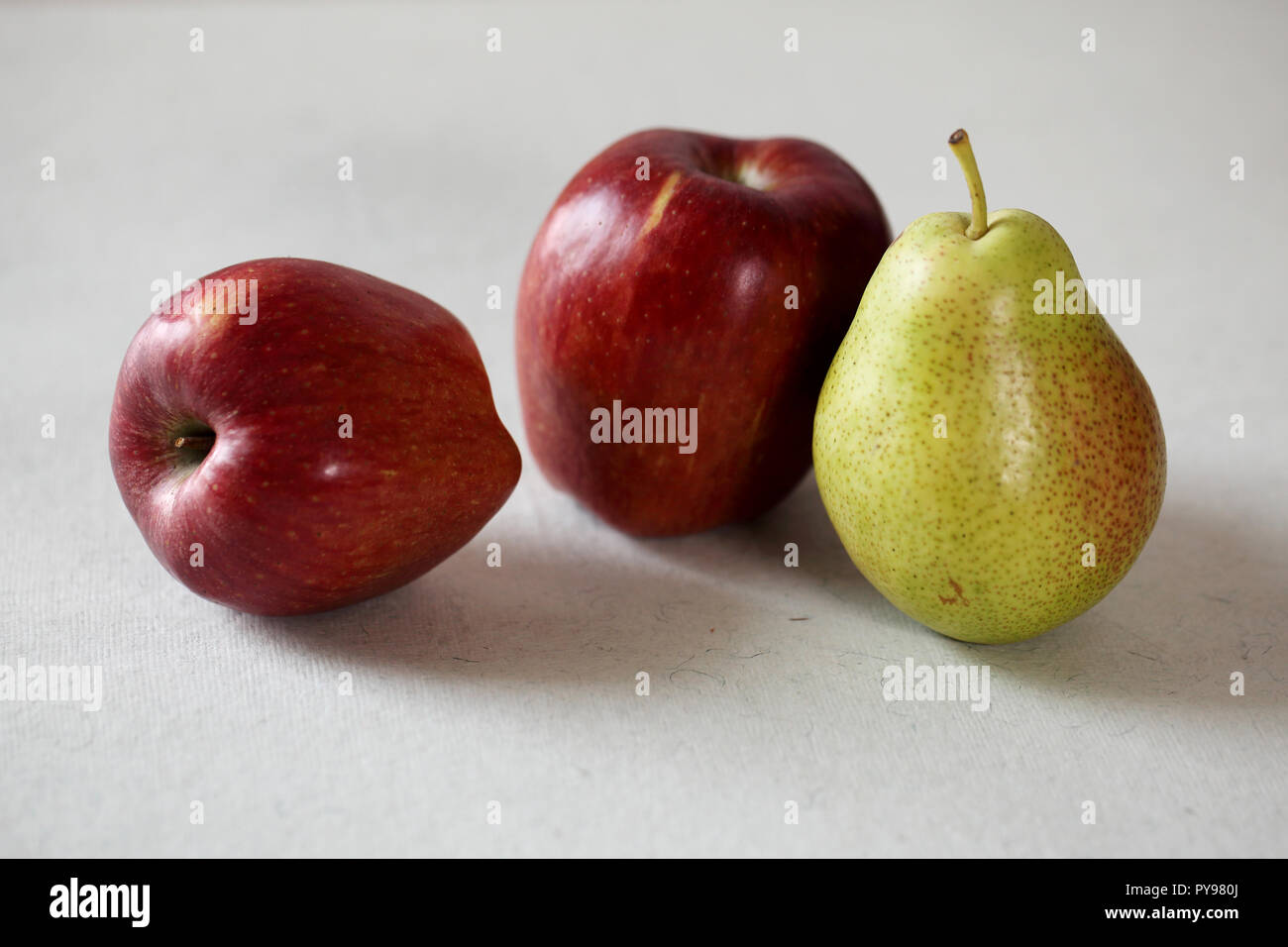 Two apples and one pear,organic fruits-Three fruits on white Stock Photo