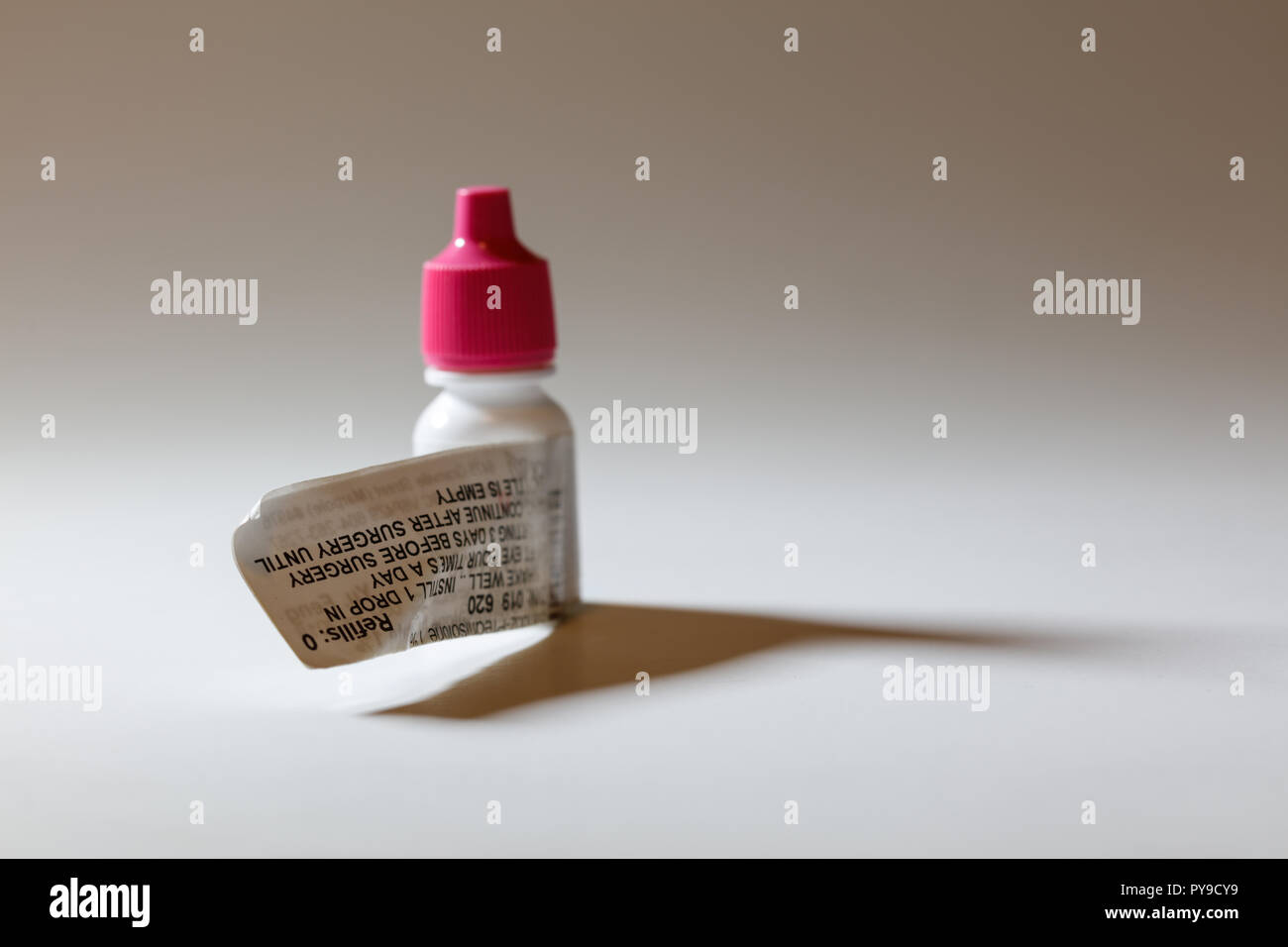 Pink cap eye drop bottle, antibiotic prescription medicine Stock Photo