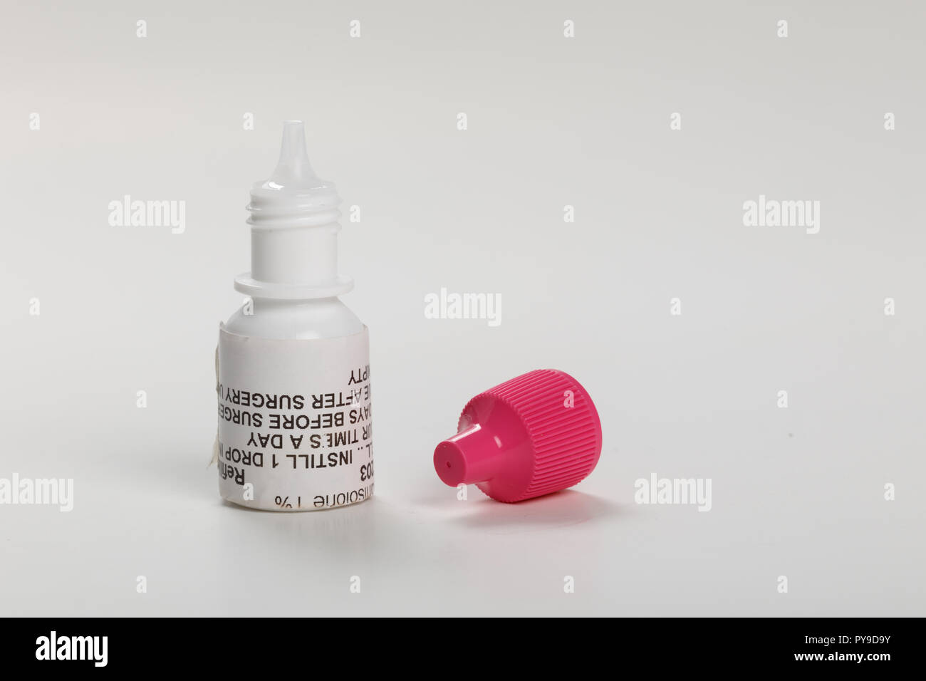 Pink cap eye drop bottle, antibiotic prescription medicine Stock Photo