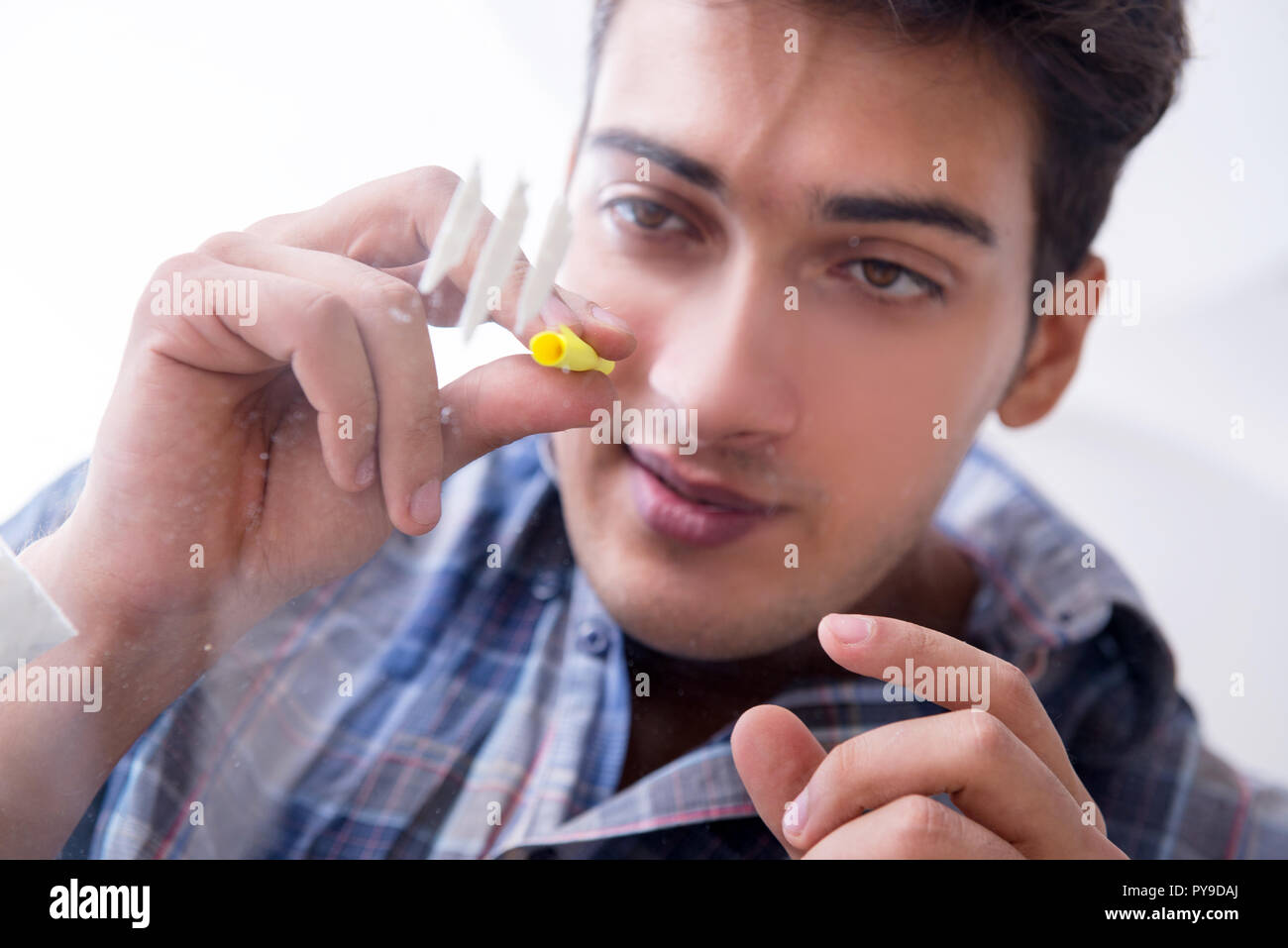 Drug addict sniffing cocaine narcotic Stock Photo - Alamy