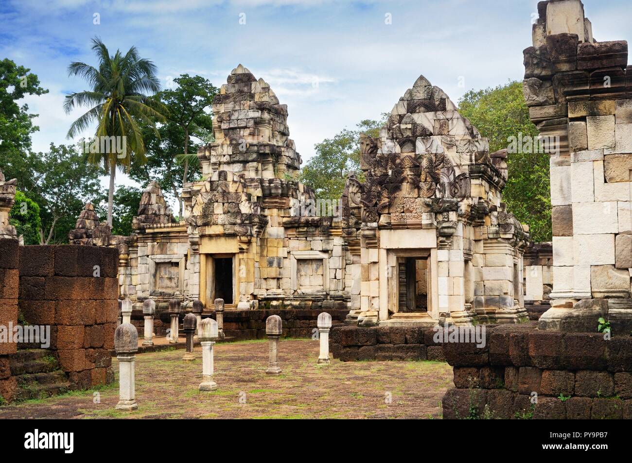 Сourtyard and libraries of 11th-century ancient Khmer temple Prasat Sdok Kok Thom built of red sandstone and laterite in Sa Kaeo province of Thailand Stock Photo