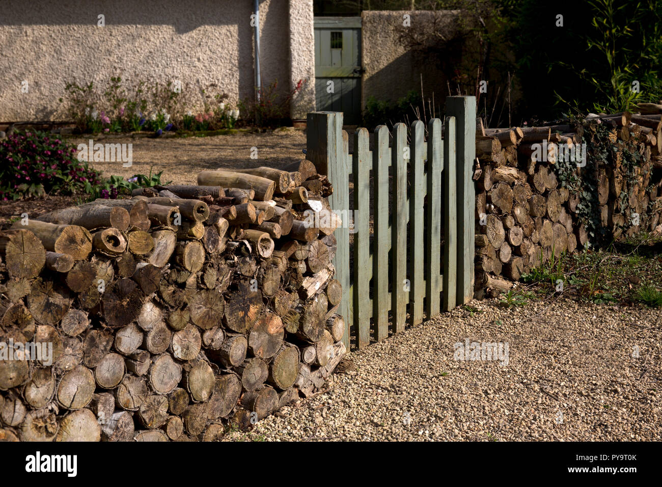 wooden gateway into English Garden with wooden log fence ,England,Europe Stock Photo