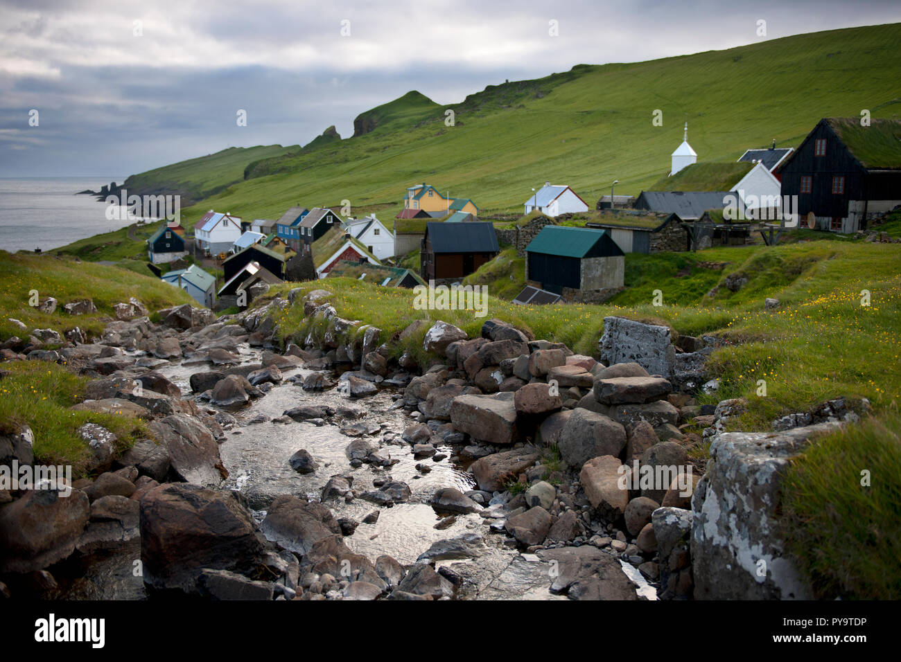 Houses and stream in the village of the Island Mykines, Faroe Islands Stock Photo