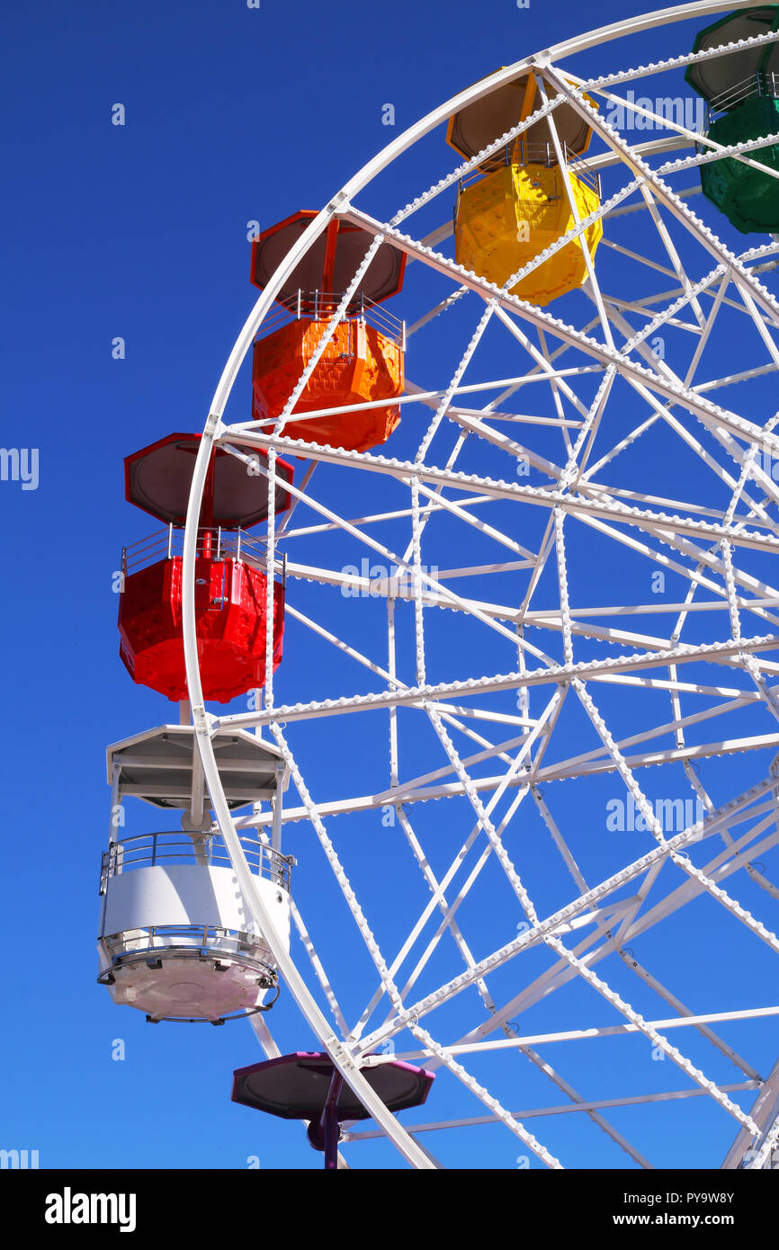 Colorful ferris wheel on a blue sky at Tibidabo park, Barcelona, Spain Stock Photo