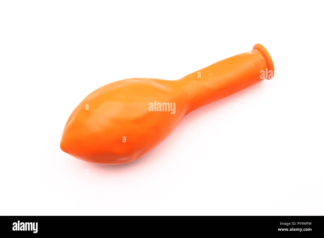 Orange deflated balloon isolated on white Stock Photo