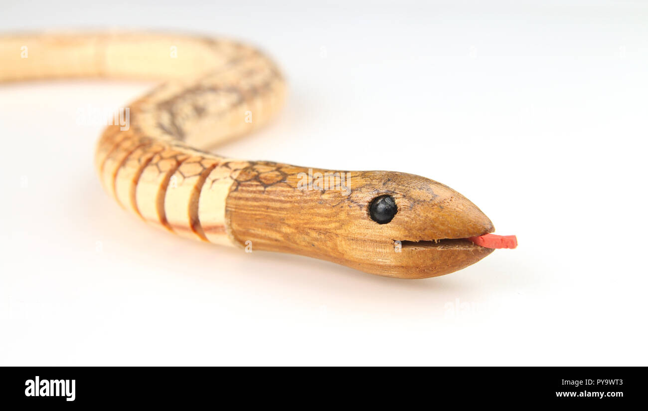 Wooden toy snake with tongue out Stock Photo
