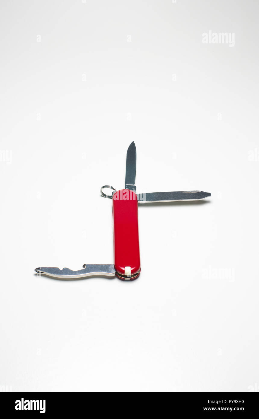 Small Swiss army knife close up isolated against white backdrop Stock