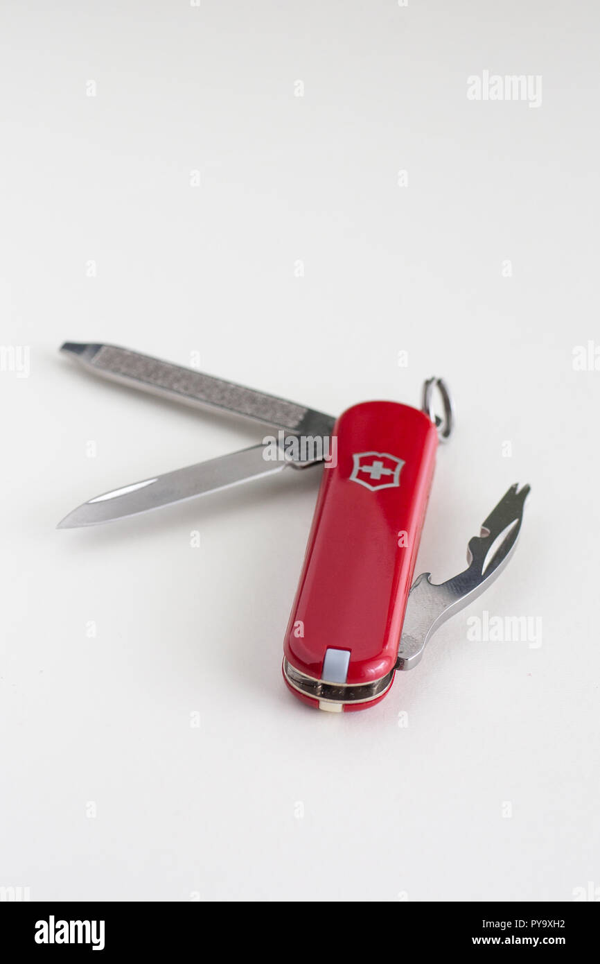 Small Swiss army knife close up isolated against white backdrop Stock