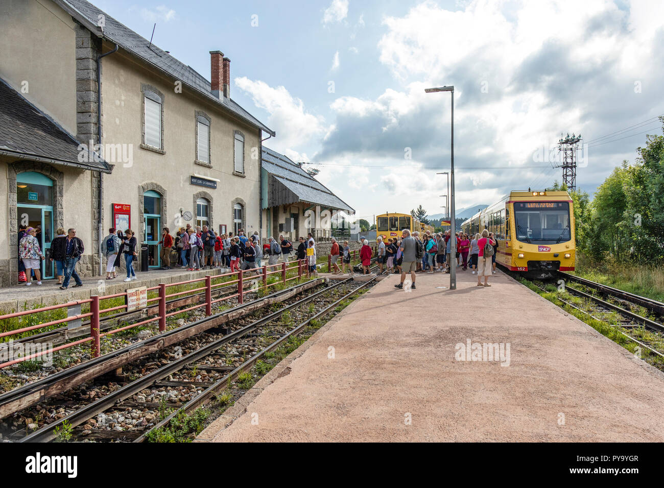 Everyone rushing of the uncomfortable Yellow Train and queing for the toilets.  Mount-Lois, the Pyrenees Stock Photo