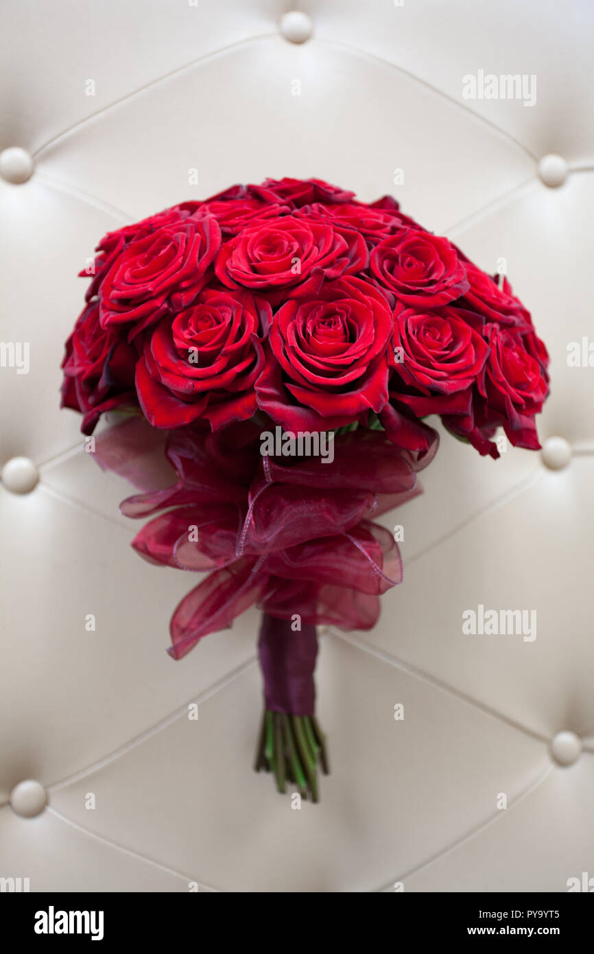 Large luxurious bouquet arrangement of vivid red roses with a pink ...