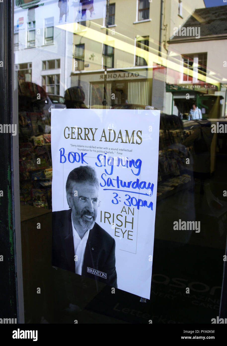 A poster in a shop window is advertising a book signing session with Gerry Adams in the town of Portrush in Northern Ireland in 2007. Stock Photo