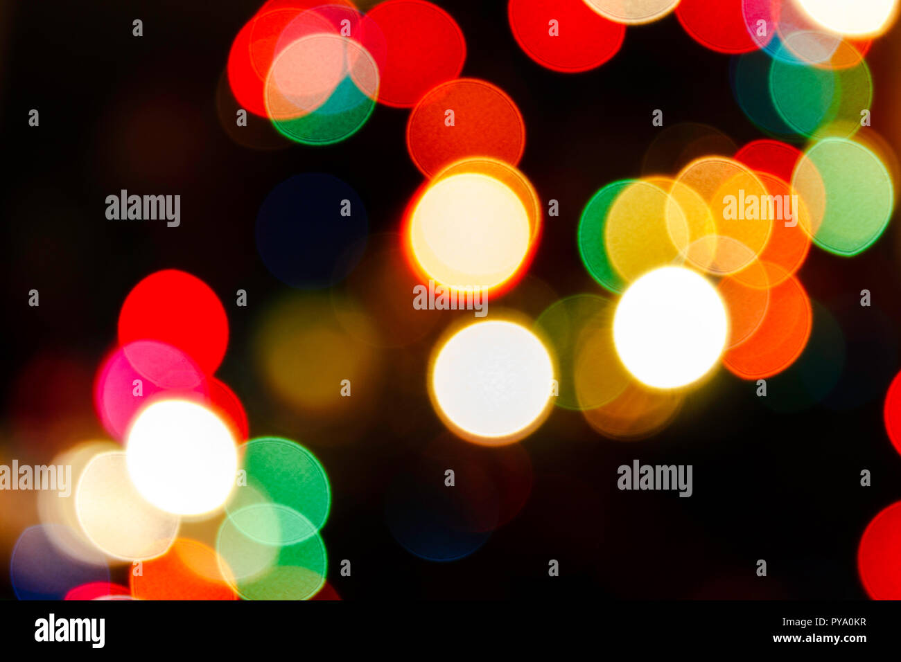 Bokeh of Christmas Lights with red, green, orange, yellow and white lights. Stock Photo