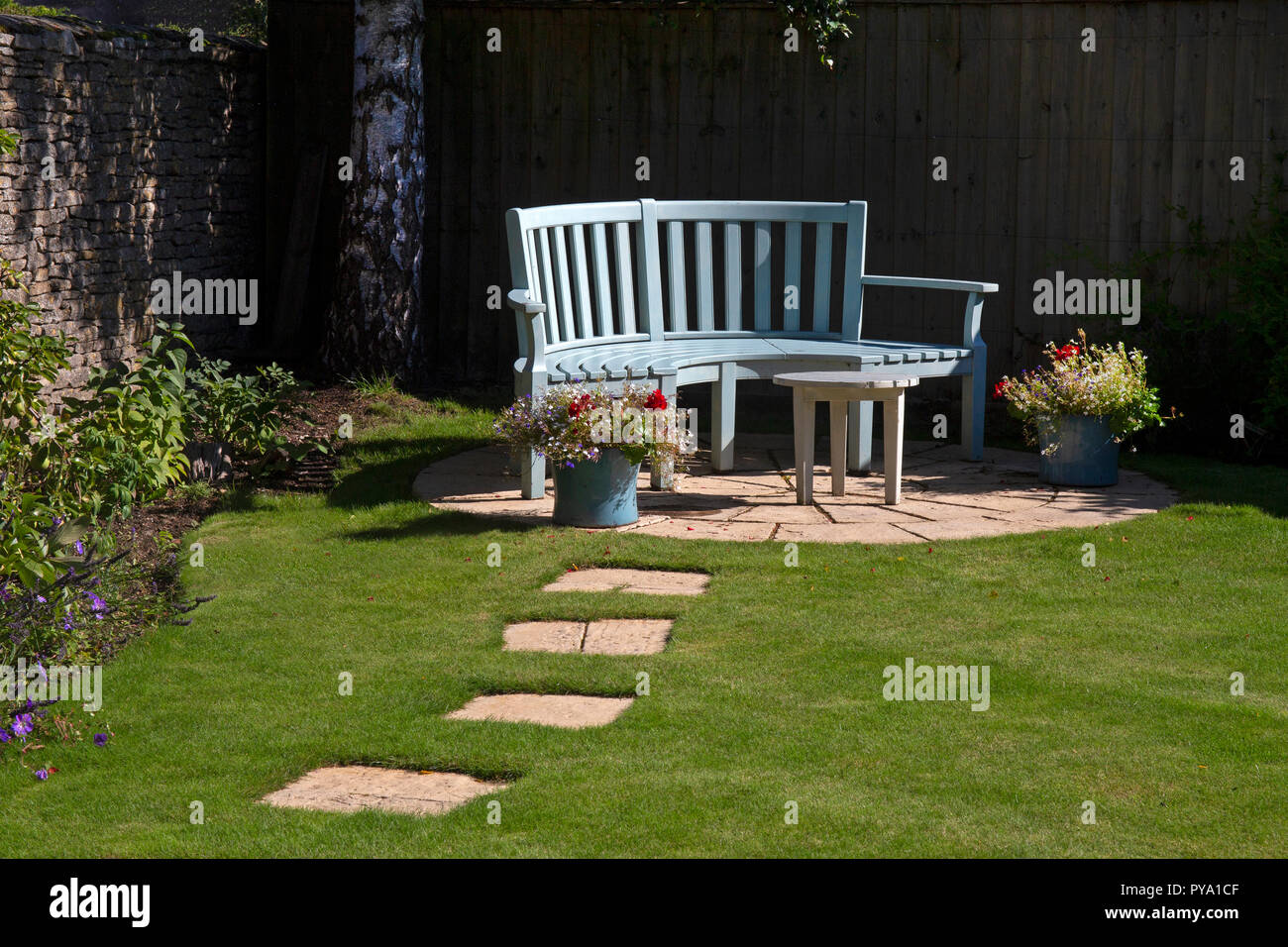 wooden bench on patio English Garden,England,Europe Stock Photo