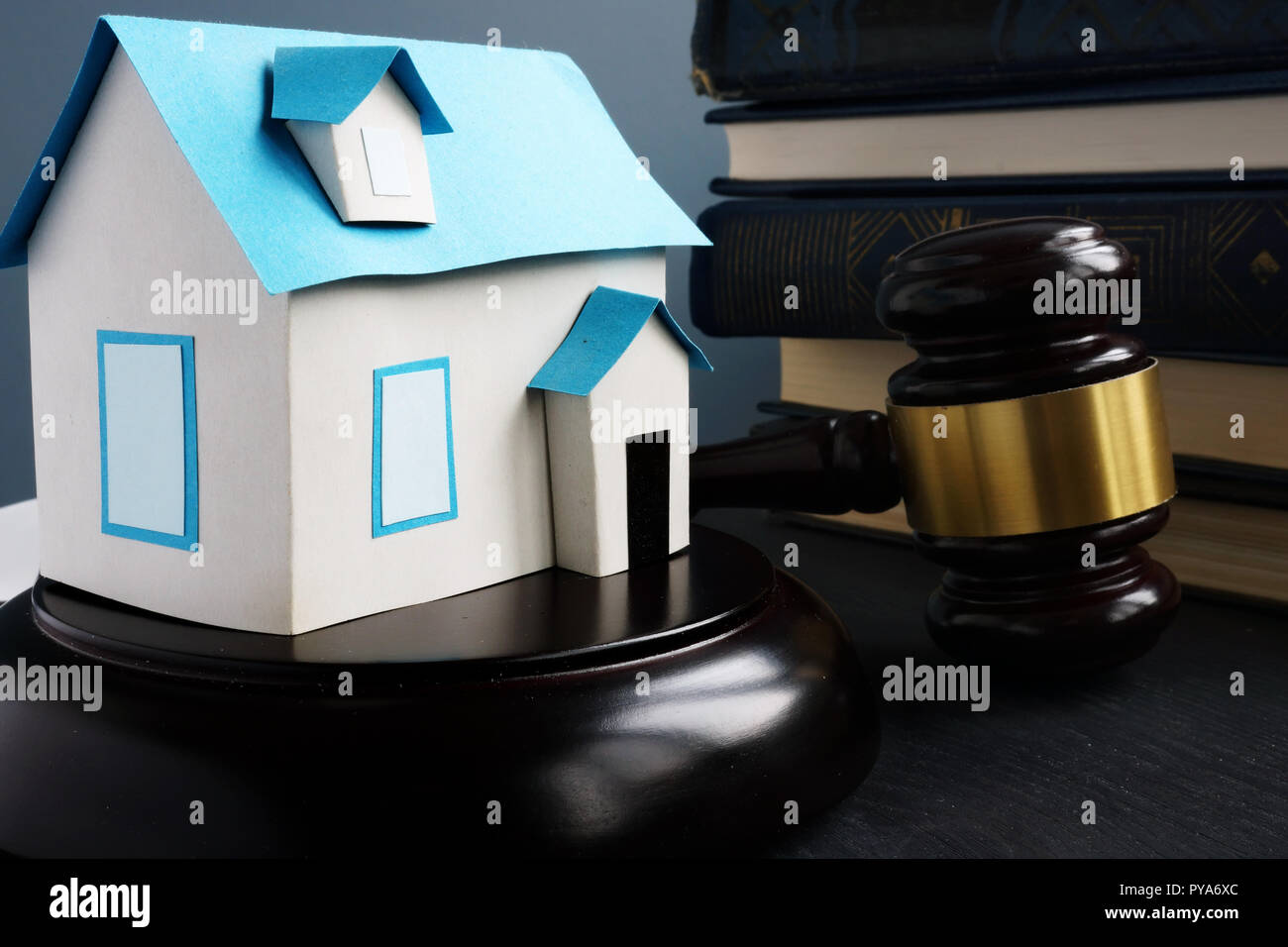 Real estate law. Model of house, gavel and books. Stock Photo
