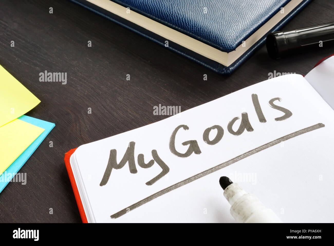 My goals handwritten in the note pad. Stock Photo