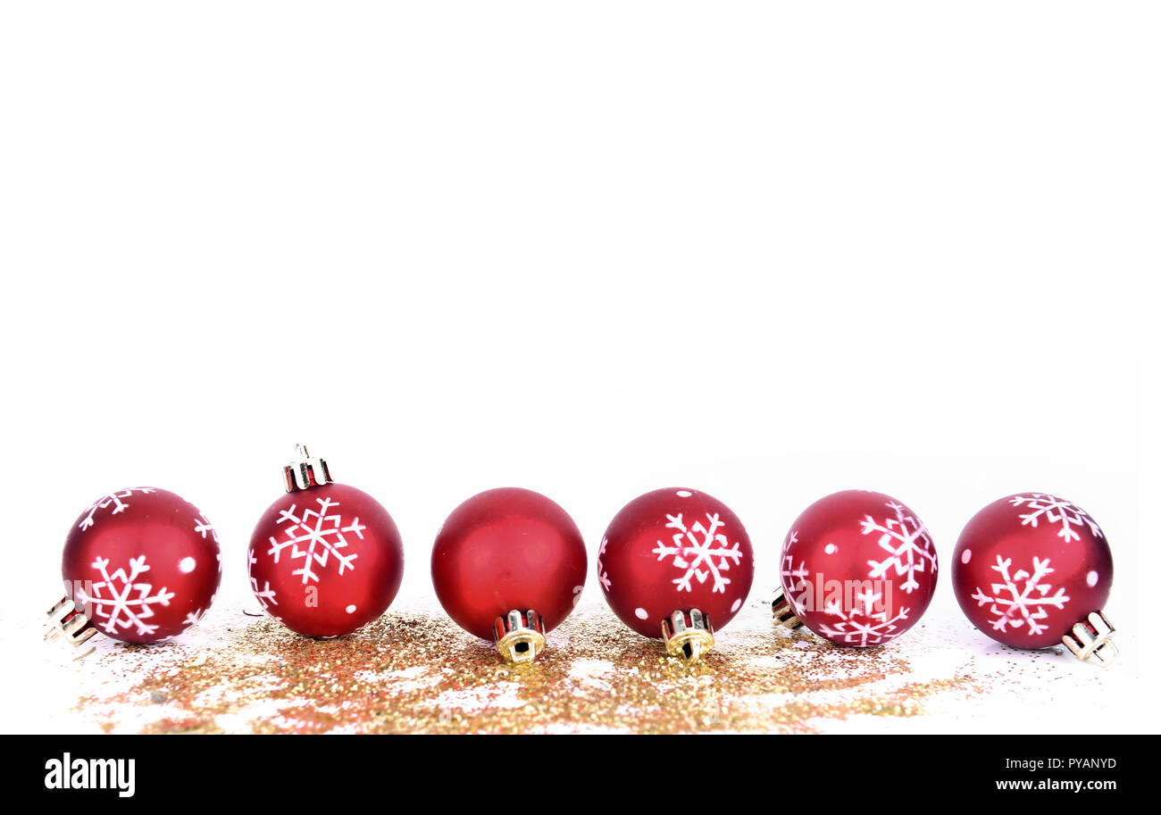 line of red christmas baubles with snowflakes shape on golden glitters  isolated on white background Stock Photo - Alamy