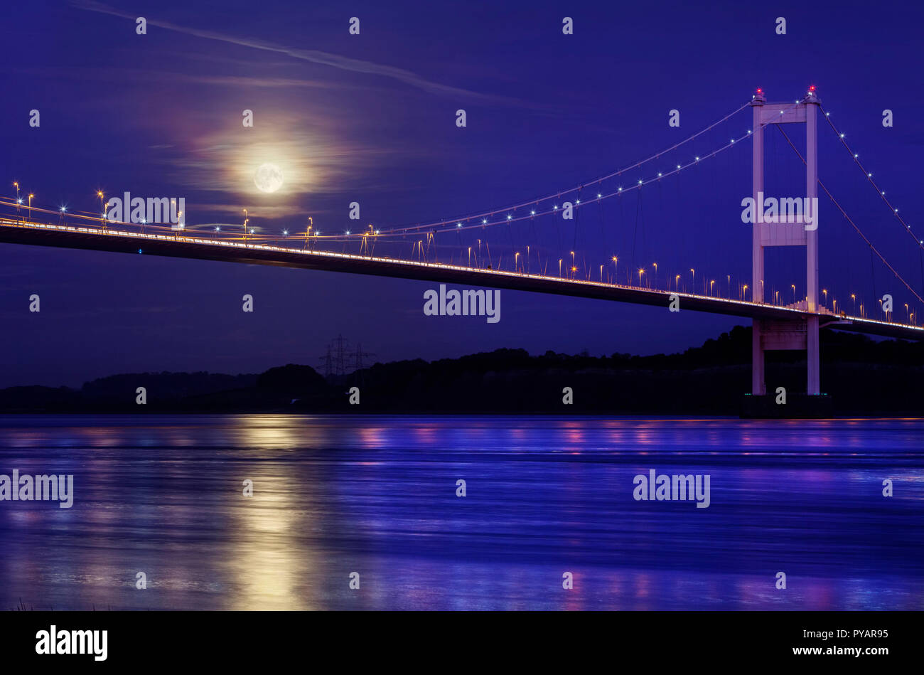 The moon rising over the old Severn Bridge, in South Gloucestershire, U.K. Stock Photo