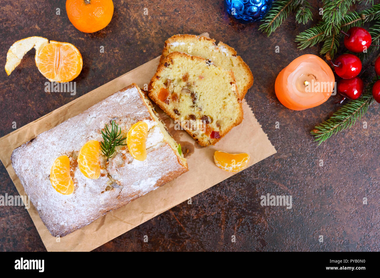 Christmas cake with nuts, dried fruit, tangerines. Traditional festive