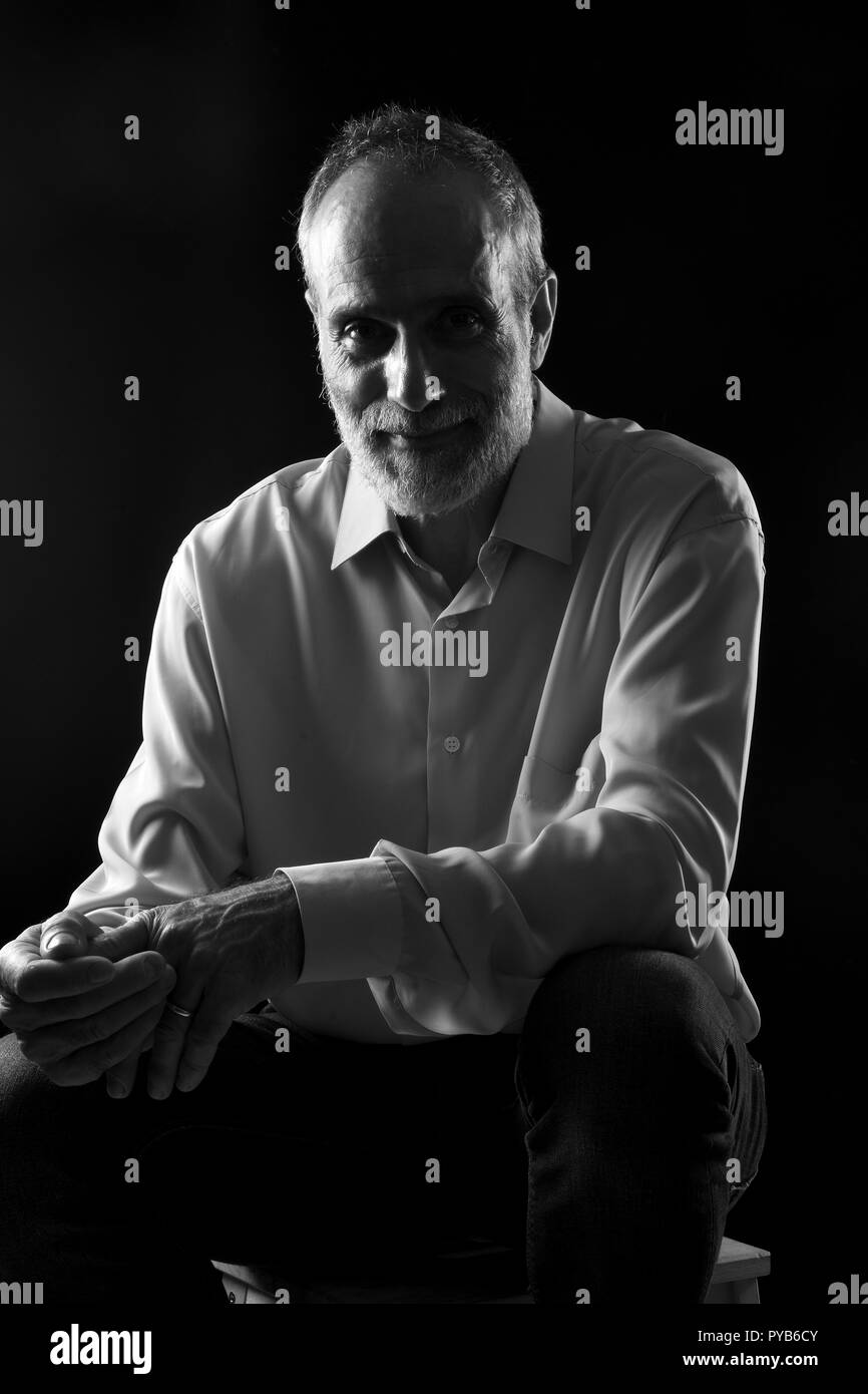 Male entrepreneur sitting on Black and White Stock Photos & Images - Alamy