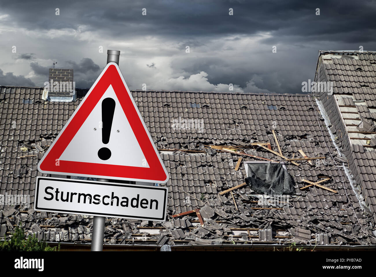 german Sturmschaden ( english translation: attention storm damage ) red warning sign in front of roof of house damaged by heavy hurricane tornado stor Stock Photo