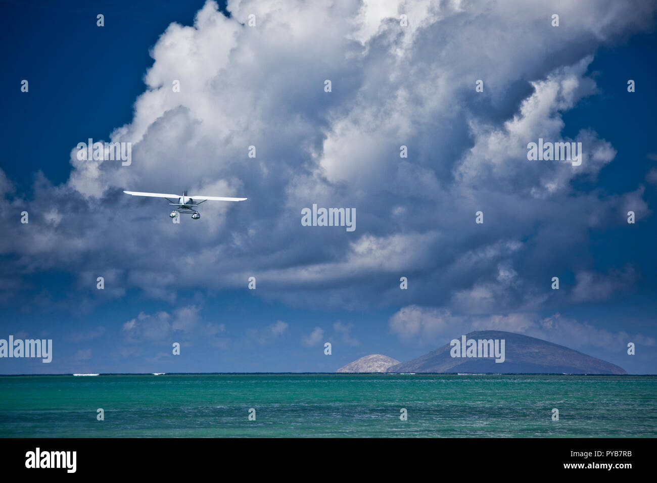 Sea plane landing off the north coast of Mauritius. Stock Photo