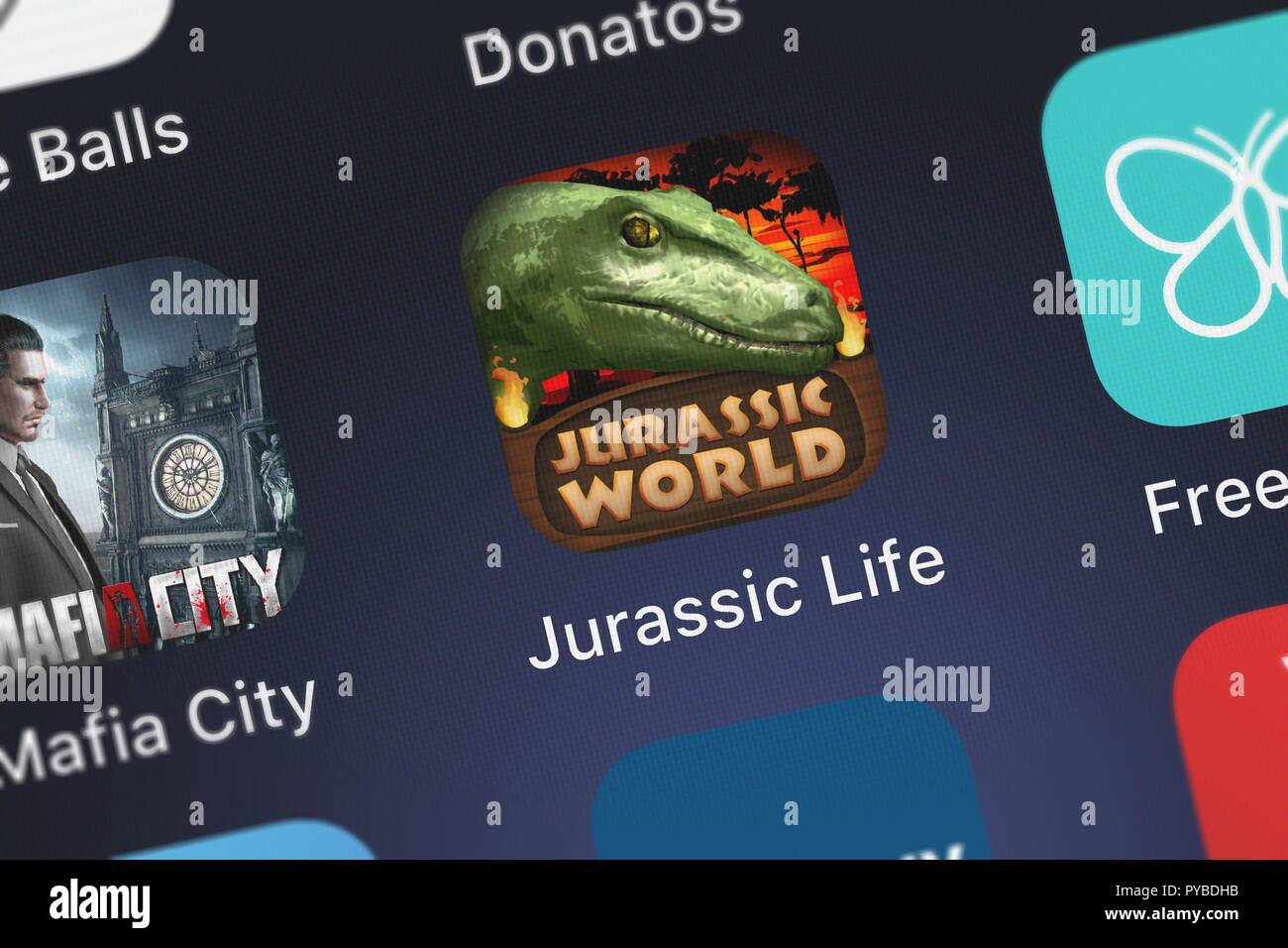 London, United Kingdom - October 26, 2018: Screenshot of the mobile app Jurassic Life: Velociraptor Dinosaur Simulator from Gluten Free Games. Stock Photo