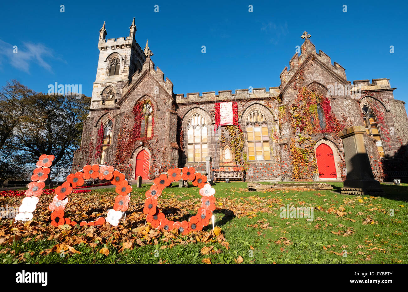 Edinburgh, Scotland, UK. 26 October, 2018. Liberton Kirk in Edinburgh is adorned with thousands of red poppies to mark the centenary of Armistice Day. The church bell tower is covered in a solid blanket of poppies made by the congregation. Credit: Iain Masterton/Alamy Live News Stock Photo