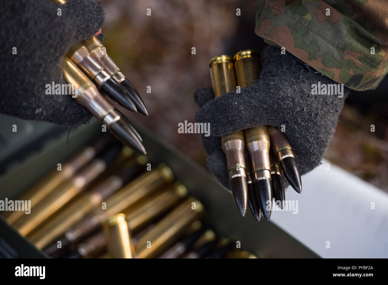 Rena, Norway. 25th Oct, 2018. 25 October 2018, Norway, Rena: As part of the NATO exercise Trident Juncture 2018, a German sniper of the third company Panzergrenadierlehrbataillon 92 collects ammunition during a joint sniper training session. Credit: Sgt Marc-Andre Gaudreault/JFC Brunssum/dpa - ATTENTION: editorial use only in connection with the latest coverage and only if the credit mentioned above is referenced in full/dpa/Alamy Live News Stock Photo