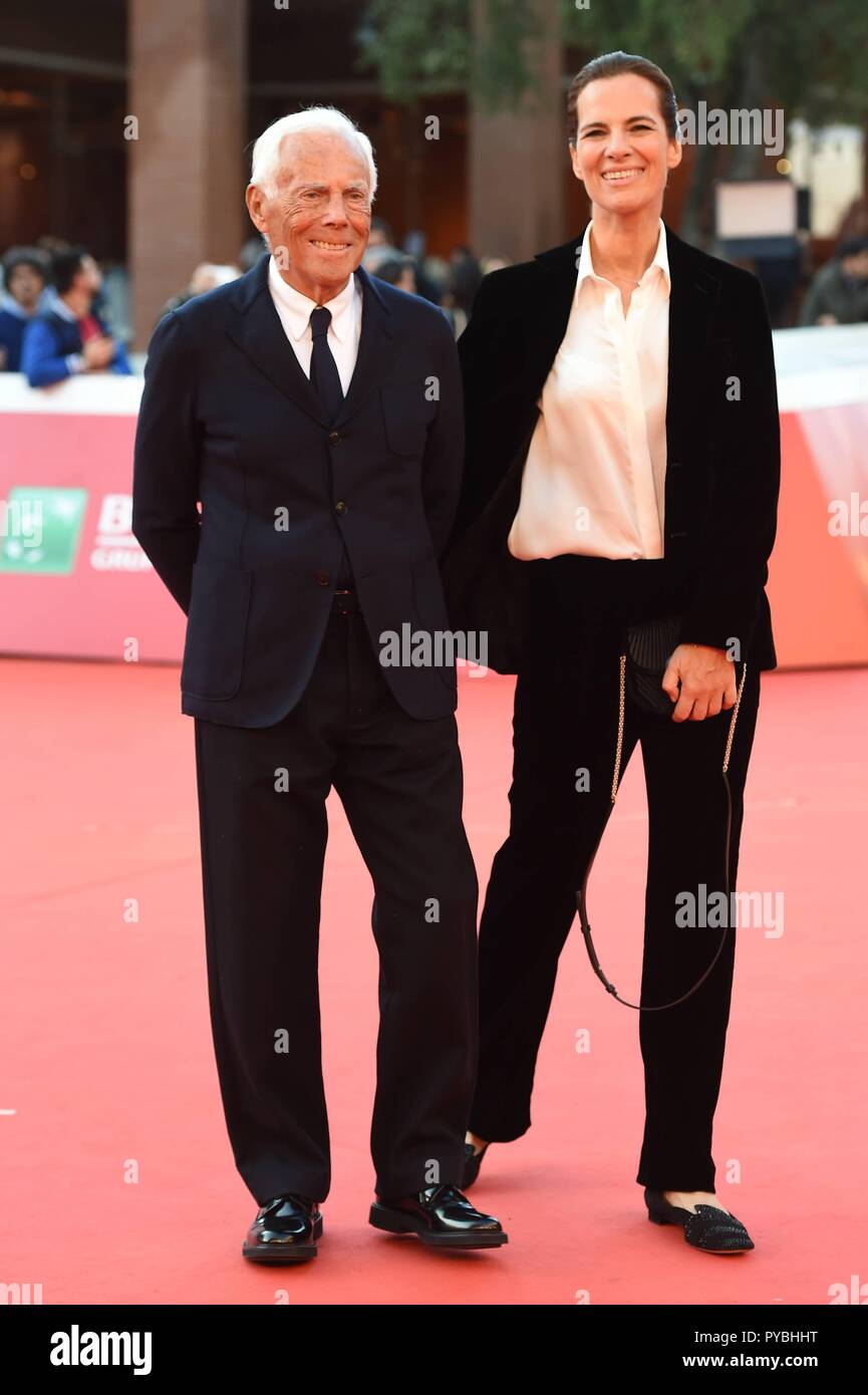 Italian designer Giorgio Armani poses with wife Roberta in the courtyard of  the Elysee Palace in Paris, France on July 3, 2008, prior to be awarded  with France's most prestigious Legion d'Honneur