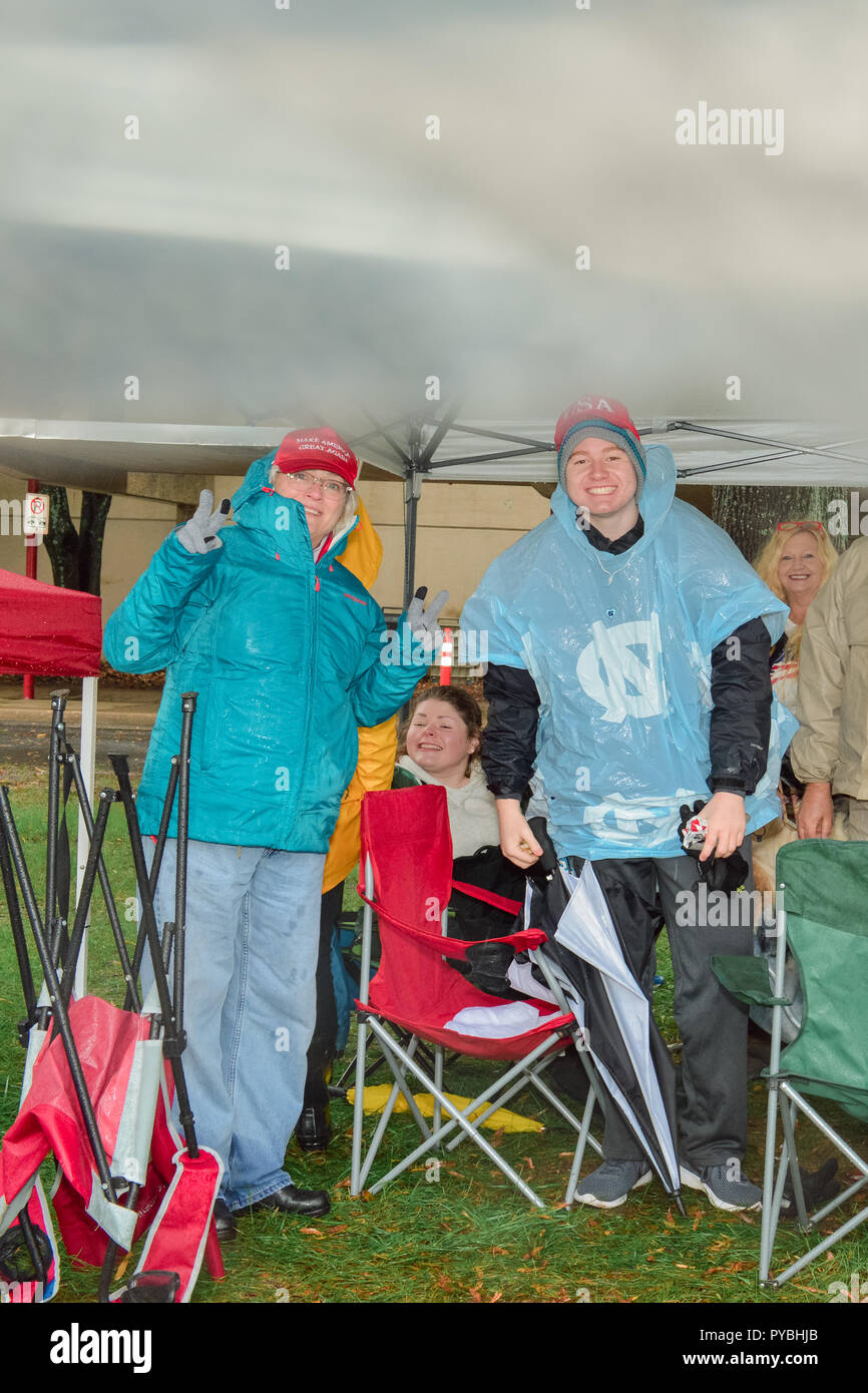 Charlotte, NC, USA. 26 October  2018. Trump supporters gladly brave the rain outside the Bojangles Arena in Charlotte in order to get good seats at the Trump MAGA Rally in Charlotte, NC tonight. Some supporters arrived at 3pm on Thursday and have camped out in tents.  Credit: Castle Light Images / Alamy Live News Stock Photo