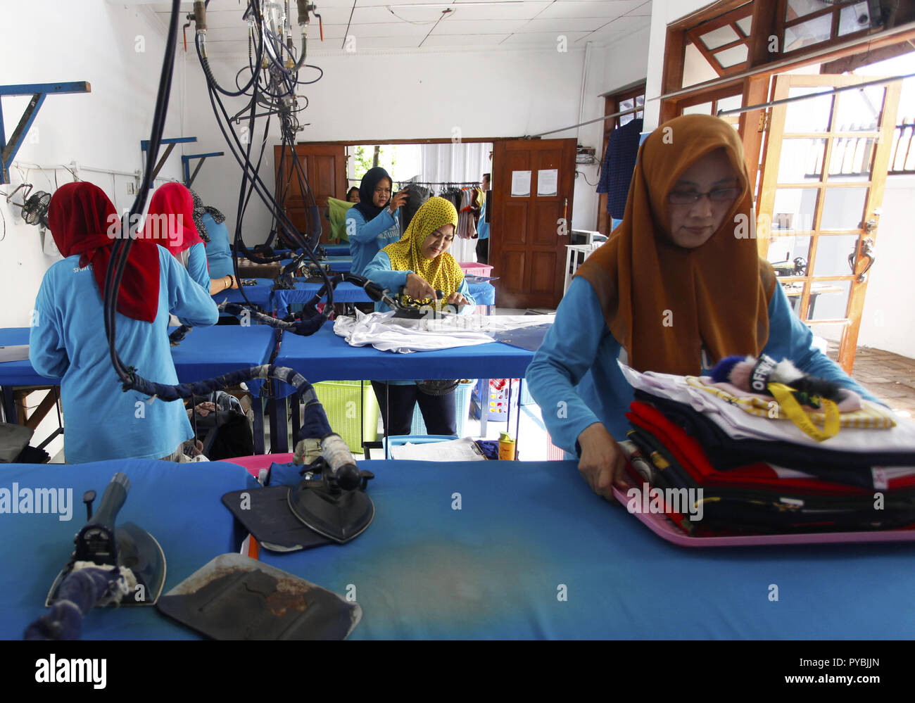 Bogor, West Java, Indonesia. 10th Apr, 2018. Workers are seen ironing  clothes at the Laundry company. Laundry companies use gas energy in the  form of Compressed Natural Gas (CNG) owned by the