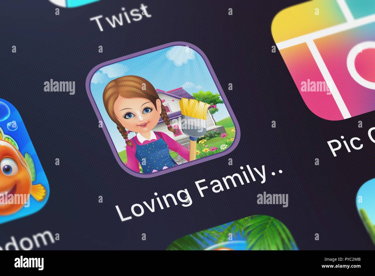 London, United Kingdom - October 26, 2018: Close-up shot of Pop-ok.com's popular app Loving Family Dream Dollhouse Lite. Stock Photo