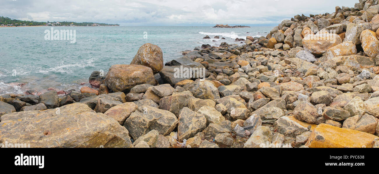 A ridge of rocks in the ocean Stock Photo - Alamy