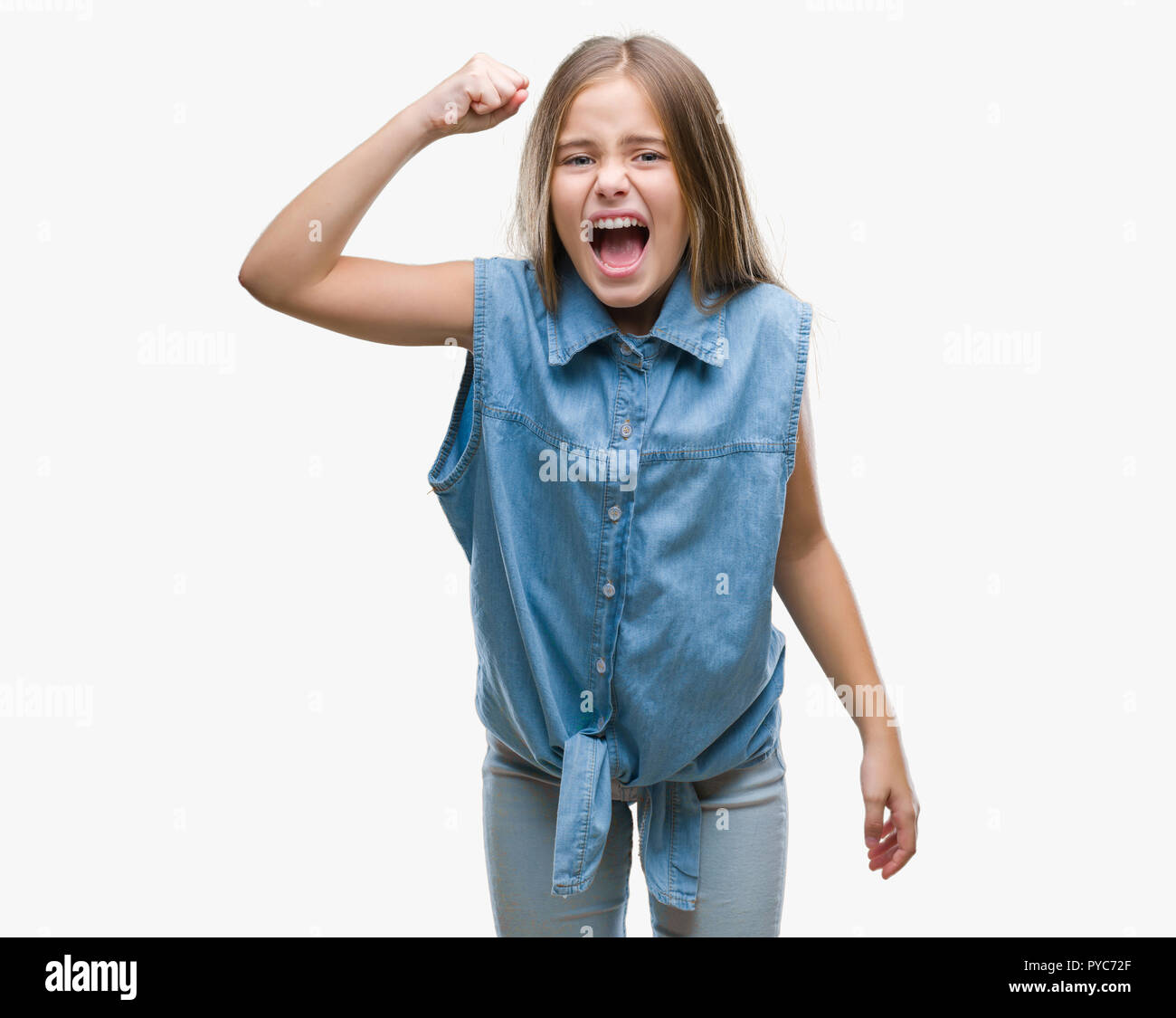 Young beautiful girl over isolated background angry and mad raising ...