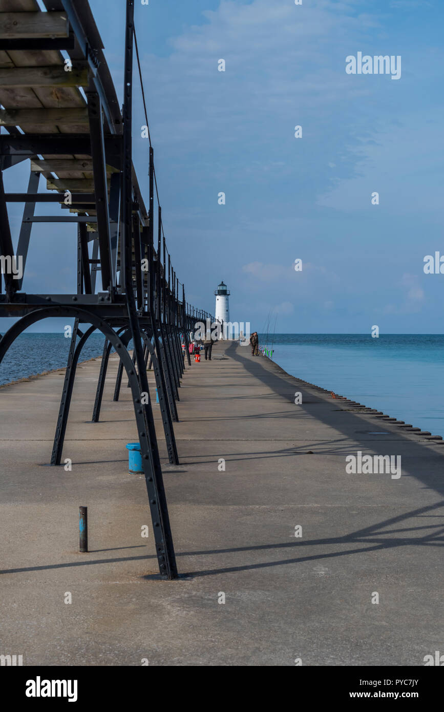 People fishing on the pier at Manistee North Pierhead Lighthouse, Lake
